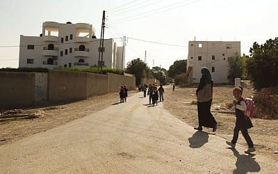 Palestinian school children on their way back from school in the West Bank village of Ouja, near Jericho, November 14, 2013. (Meital Cohen/FLASH90)