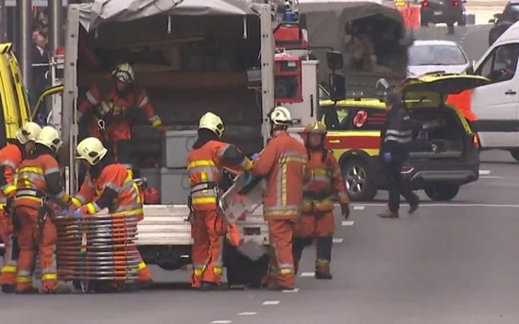 Rescue personnel attend the scene of blast at a metro station in Maalbeek, Brussels on March 22, 2016 (screen capture: YouTube)