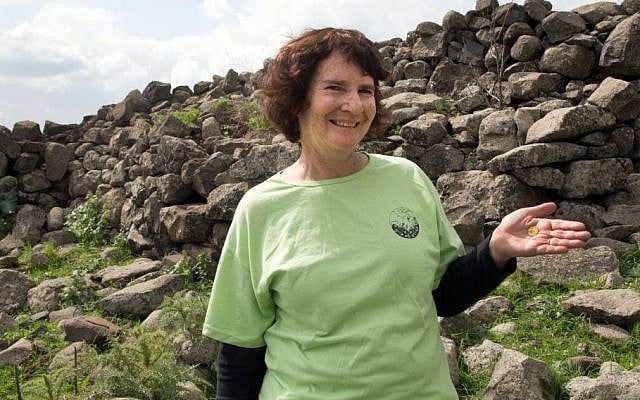 Laurie Rimon with a 2,000 year old coin she found while out hiking. (Samuel Magal, courtesy of the Israel Antiquities Authority)