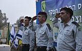 Brig.-Gen. Ofek Buchris, right, salutes during a ceremony to mark his exit as commander of the Bashan Division, along with head of the Northern Command Maj.-Gen. Aviv Kochavi, center, and Brig.-Gen. Yaniv Asur, in September 2015. (IDF Spokesperson's Unit)