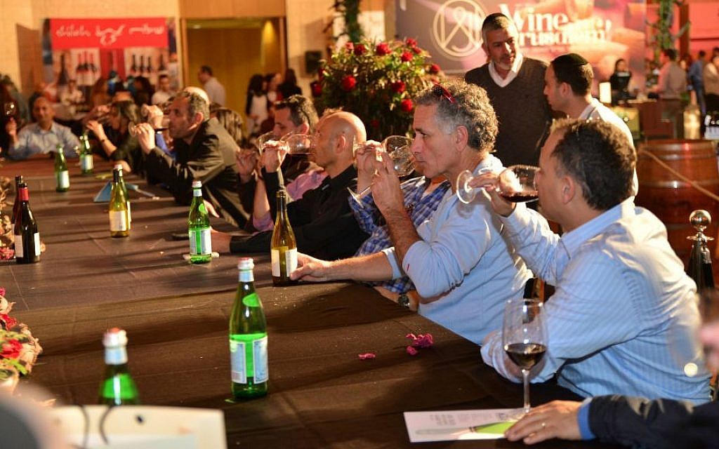 Tasting and spitting at Wine Jerusalem 2015; this year's expo opens Wednesday night at Binyanei Hauma, the International Convention Center (Courtesy Wine Jerusalem) Tasting and spitting at Wine Jerusalem 2015; this year's expo opens Wednesday night at Binyanei Hauma, the International Convention Center (Courtesy Wine Jerusalem)