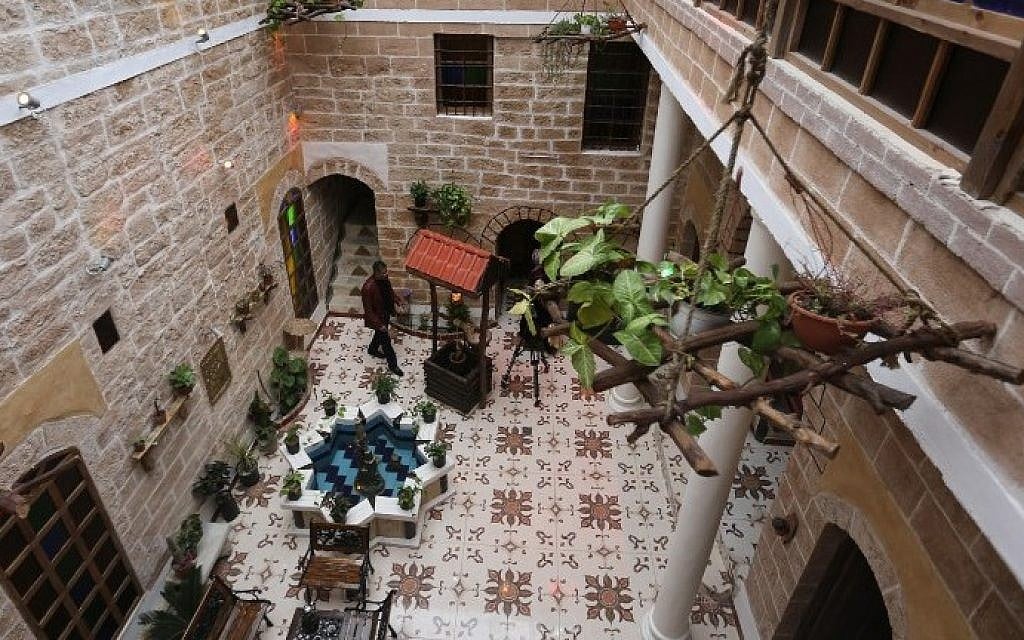 Palestinian university professor Atef Salama stands in his house, a 430-year-old Levantine-style palace, on February 6, 2016, in Gaza City. (AFP PHOTO / MAHMUD HAMS) Palestinian university professor Atef Salama stands in his house, a 430-year-old Levantine-style palace, on February 6, 2016, in Gaza City. (AFP PHOTO / MAHMUD HAMS)