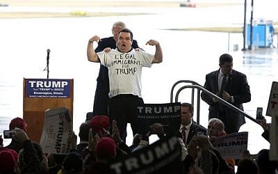 Republican Presidential hopeful Donald Trump shares the stage with Alex Stypik at a rally at Synergy Flight Center on March 13, 2016 in Bloomington ,Illinois. (AFP PHOTO / Tasos Katopodis) Republican Presidential hopeful Donald Trump shares the stage with Alex Stypik at a rally at Synergy Flight Center on March 13, 2016 in Bloomington ,Illinois. (AFP PHOTO / Tasos Katopodis)