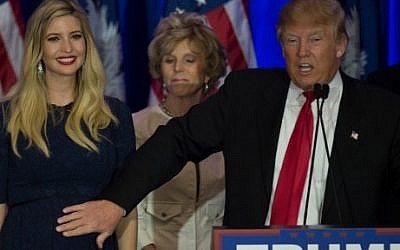 This file photo taken on February 20, 2016 shows Republican presidential candidate Donald Trump patting his expecting daughter Ivanka Trump while celebrating victory in the South Carolina primary in Spartanburg, South Carolina. (AFP / JIM WATSON)