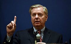 Senator Lindsey Graham gestures during a press conference with members of his Congressional delegation in Cairo, Egypt, on April 3, 2016. (AFP/Mohamed el-Shahed)