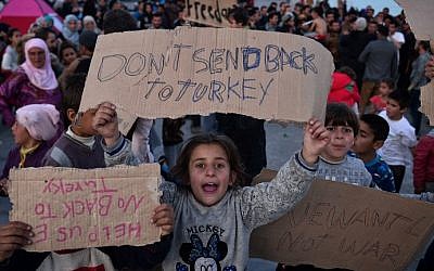 Child refugees protest on the Greek island of Chios, April 3, 2016. (AFP/Louisa Gouliamaki)