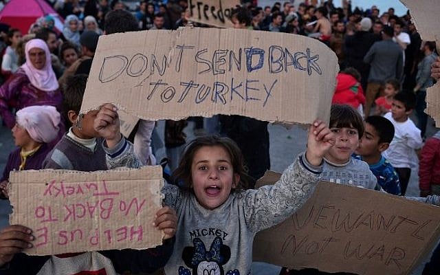 Child refugees protest on the Greek island of Chios, April 3, 2016. (AFP/Louisa Gouliamaki)