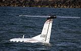 A light plane after it made an emergency landing in the Mediterranean off the coast of Tel Aviv, on April 3, 2016. (AFP / JACK GUEZ)