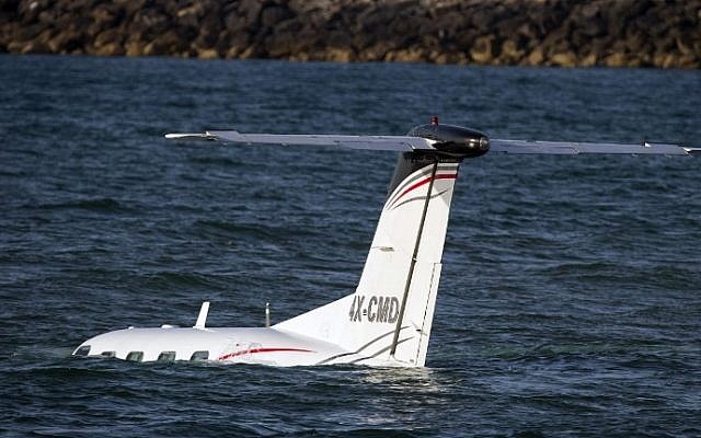 A light plane after it made an emergency landing in the Mediterranean off the coast of Tel Aviv, on April 3, 2016. (AFP / JACK GUEZ)