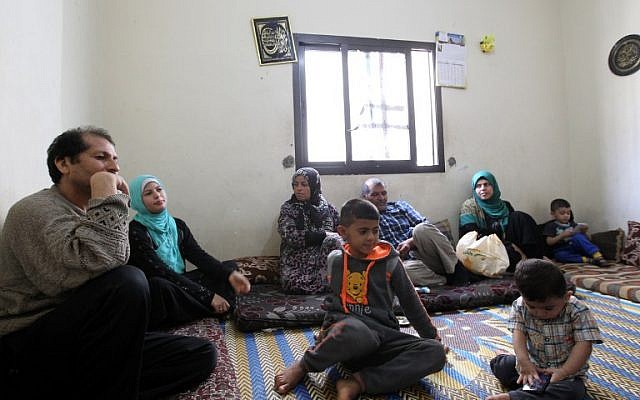 A Syrian family rest in a room where they are residing in the Shatila Palestinian refugee camp on the southern outskirts of the Lebanese capital, Beirut, April 5, 2016. (AFP/ANWAR AMRO) A Syrian family rest in a room where they are residing in the Shatila Palestinian refugee camp on the southern outskirts of the Lebanese capital, Beirut, April 5, 2016. (AFP/ANWAR AMRO)
