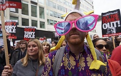 Protesters demonstrate against British Prime Minister David Cameron outside the Conservative Party's Spring Forum in central London on April 9, 2016. (Niklas Halle'n/AFP)