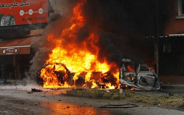 Flames engulf the wreckage of a car following a bomb explosion in southern Lebanese port city of Sidon on April 12, 2016. (AFP PHOTO / MAHMOUD ZAYYAT) Flames engulf the wreckage of a car following a bomb explosion in southern Lebanese port city of Sidon on April 12, 2016. (AFP PHOTO / MAHMOUD ZAYYAT)