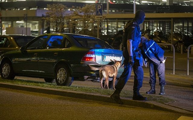 Dutch Royal Marshals inspect a car with a Belgian license at Schiphol Airport in Amsterdam, The Netherlands, on April 12, 2016. (AFP/ANP/Michel van Bergen) Dutch Royal Marshals inspect a car with a Belgian license at Schiphol Airport in Amsterdam, The Netherlands, on April 12, 2016. (AFP/ANP/Michel van Bergen)