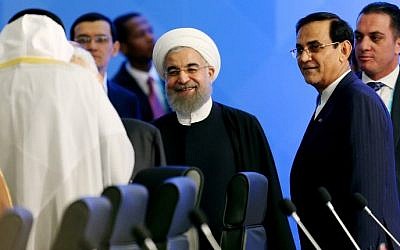 President of Iran Hassan Rouhani (C) attends the 13th Organization of Islamic Cooperation (OIC) Summit at Istanbul Congress Center (ICC) on April 14, 2016 in Istanbul. (AFP/SEBNEM COSKUN)