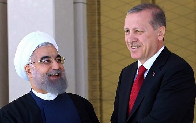 Turkish President Recep Tayyip Erdogan (R) shakes hands with his Iranian counterpart Hassan Rouhani during an official welcoming ceremony at the presidential complex in Ankara on April 16, 2016. (AFP PHOTO / ADEM ALTAN) Turkish President Recep Tayyip Erdogan (R) shakes hands with his Iranian counterpart Hassan Rouhani during an official welcoming ceremony at the presidential complex in Ankara on April 16, 2016. (AFP PHOTO / ADEM ALTAN)