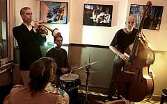 The "Olden You Quartet" plays at the Beit Haamudim bar and jazz club during a concert in Tel Aviv on April 5, 2016. (AFP PHOTO / MENAHEM KAHANA)