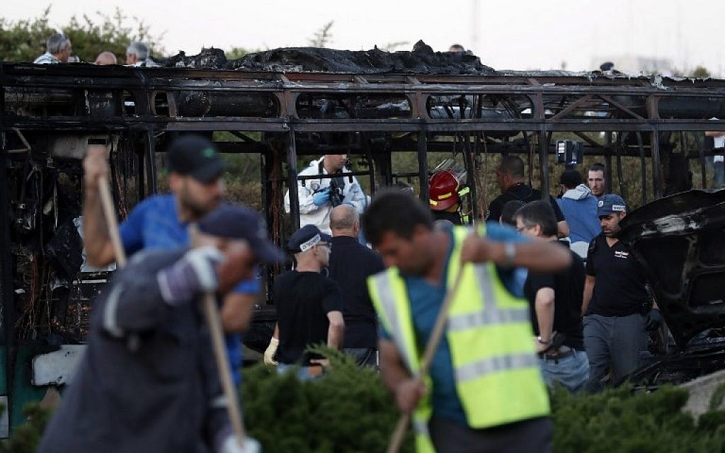Israeli forensics experts collect evidence at the scene of an explosion on a bus in Jerusalem on April 18, 2016.
(AFP PHOTO/THOMAS COEX) Israeli forensics experts collect evidence at the scene of an explosion on a bus in Jerusalem on April 18, 2016.
(AFP PHOTO/THOMAS COEX)