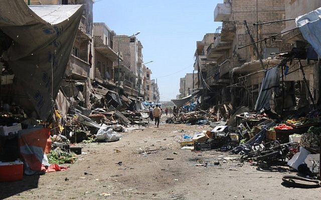 File: Syrians look at damage following an air strike on a vegetable market in Maaret al-Numan, in Syria's northern province of Idlib, April 19, 2016. (AFP Photo/Mohamed al-Bakour) File: Syrians look at damage following an air strike on a vegetable market in Maaret al-Numan, in Syria's northern province of Idlib, April 19, 2016. (AFP Photo/Mohamed al-Bakour)