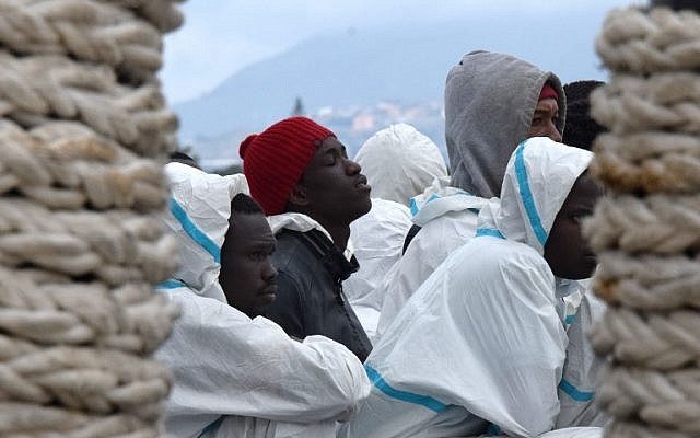 Men waiting to disembark from the Italian Coast Guard vessel "Dattilo" in the port of Messina, Sicily, following a rescue operation of migrants and refugees at sea, February 1, 2016. (AFP/GIOVANNI ISOLINO) Men waiting to disembark from the Italian Coast Guard vessel "Dattilo" in the port of Messina, Sicily, following a rescue operation of migrants and refugees at sea, February 1, 2016. (AFP/GIOVANNI ISOLINO)