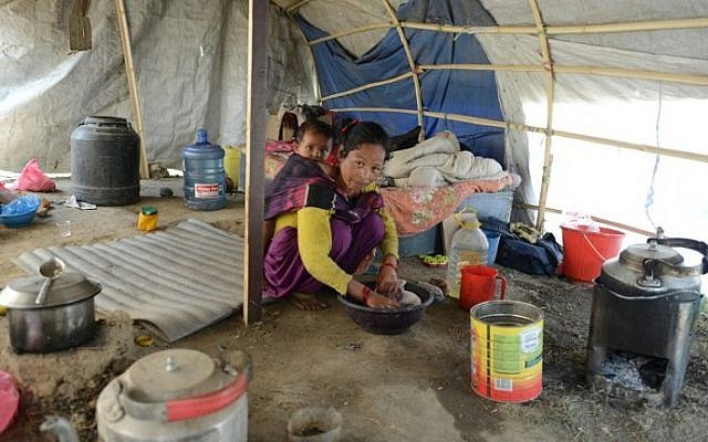 In this photograph taken on April 21, 2016, Nepalese earthquake survivor Menuka Rokaya cares for her child as she speaks with AFP in Ramechhap on the outskirts of Kathmandu. (AFP PHOTO / PRAKASH MATHEMA) In this photograph taken on April 21, 2016, Nepalese earthquake survivor Menuka Rokaya cares for her child as she speaks with AFP in Ramechhap on the outskirts of Kathmandu. (AFP PHOTO / PRAKASH MATHEMA)