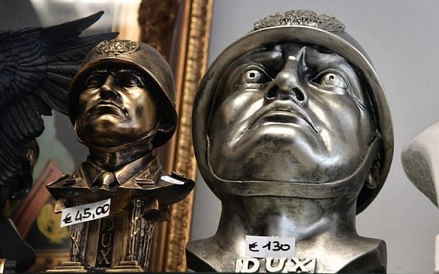 Busts of Italian dictator Benito Mussolini are on display in a souvenirs shop during a rally of far-right militants to celebrate the life and the death of Mussolini in Predappio, on April 24, 2016. (AFP PHOTO / TIZIANA FABI)