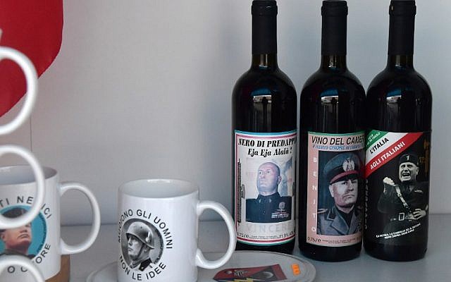 Bottles of wine and mugs celebrating Italian dictator Benito Mussolini are on display in a souvenirs shop during a rally of far-right militants to celebrate the life and the death of Mussolini in Predappio, on April 24, 2016. (AFP PHOTO / TIZIANA FABI)