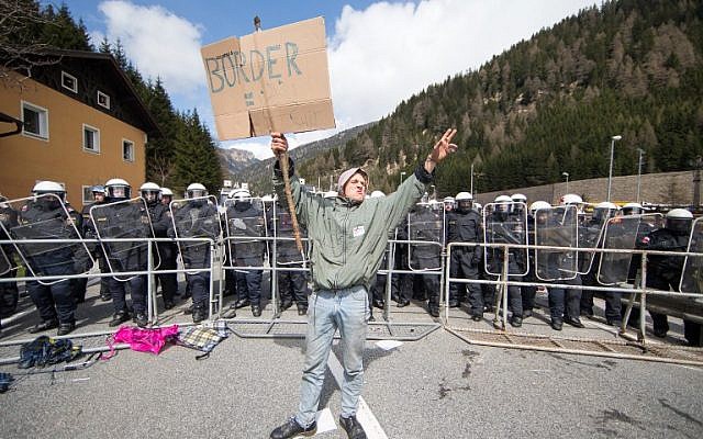 A young man protests against planned border controls at the border station "Brenner" between Austria and Italy on April 24, 2016. (AFP Photo/APA/Johann Groder)