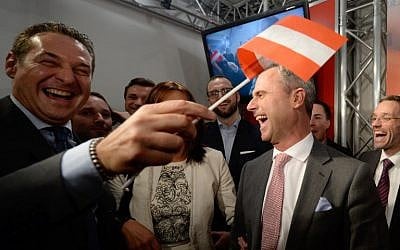 Austrian presidential candidate Norbert Hofer (right) of the right-wing Freedom Party celebrates after hearing preliminary election results in Vienna, April 24, 2016. (AFP/APA/Robert Jaeger)