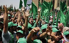 Palestinian students who support the Hamas movement take part in an election campaign rally for the student council at Birzeit University, near the West Bank city of Ramallah on April 26, 2016 (AFP/Abbas Momani)