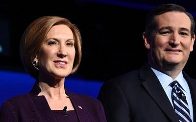 Republican presidential hopefuls Carly Fiorina (L) and Ted Cruz waiting for the start of the CNBC Republican Presidential Debate at the Coors Event Center at the University of Colorado in Boulder, Colorado on October 28, 2015. (AFP PHOTO / ROBYN BECK)