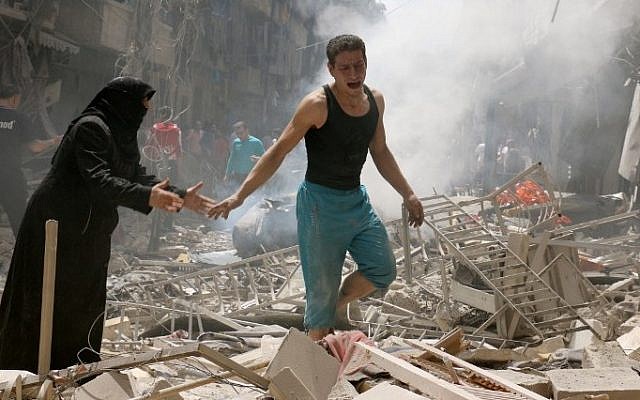 People walk amid the rubble of destroyed buildings following a reported air strike on the rebel-held neighbourhood of al-Kalasa in the northern Syrian city of Aleppo, on April 28, 2016.
(AFP/ AMEER ALHALBI) People walk amid the rubble of destroyed buildings following a reported air strike on the rebel-held neighbourhood of al-Kalasa in the northern Syrian city of Aleppo, on April 28, 2016.
(AFP/ AMEER ALHALBI)