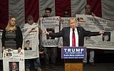 Republican presidential candidate Donald Trump brings a group of people onstage who say their relatives were killed by illegal immigrants, at a campaign rally at the Orange County Fair and Event Center, April 28, 2016, in Costa Mesa, California. (AFP/David McNew)