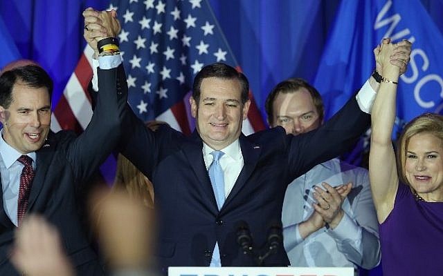 Republican presidential candidate Sen. Ted Cruz (R-TX) celebrates with his wife Heidi and Wisconsin Gov. Scott Walker at the American Serb Hall Banquet Center after the polls closed on April 5, 2016 in Milwaukee, Wisconsin. (Scott Olson/Getty Images/AFP)