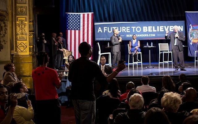 A man interrupts Democratic presidential candidate Sen. Bernie Sanders during a Community Conversation at the Apollo Theater in the Harlem neighborhood of New York City April 9, 2016. (Eric Thayer/Getty Images/AFP) A man interrupts Democratic presidential candidate Sen. Bernie Sanders during a Community Conversation at the Apollo Theater in the Harlem neighborhood of New York City April 9, 2016. (Eric Thayer/Getty Images/AFP)