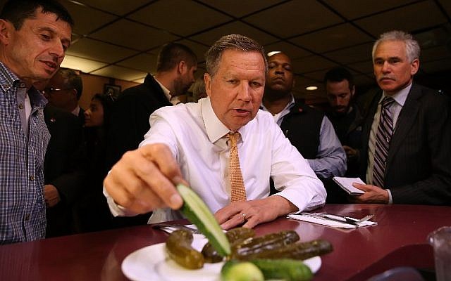 Republican presidential candidate John Kasich eats pickles while having lunch at PJ Bernstein's Deli Restaurant on April 16, 2016 in New York City.(Justin Sullivan/Getty Images/AFP) Republican presidential candidate John Kasich eats pickles while having lunch at PJ Bernstein's Deli Restaurant on April 16, 2016 in New York City.(Justin Sullivan/Getty Images/AFP)