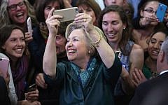 Democratic presidential front-runner Hillary Clinton takes selfies with supporters at a campaign rally on April 24, 2016 in Bridgeport, Connecticut. (John Moore/Getty Images/AFP)