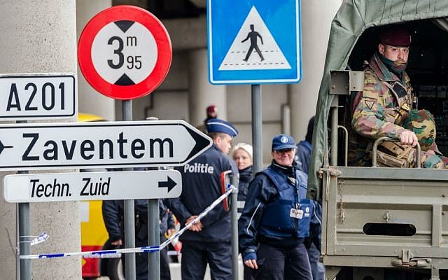 Belgian police and soldiers secure the area outside Zaventem Airport in Brussels, Tuesday, March 29, 2016. (AP Photo/Geert Vanden Wijngaert)