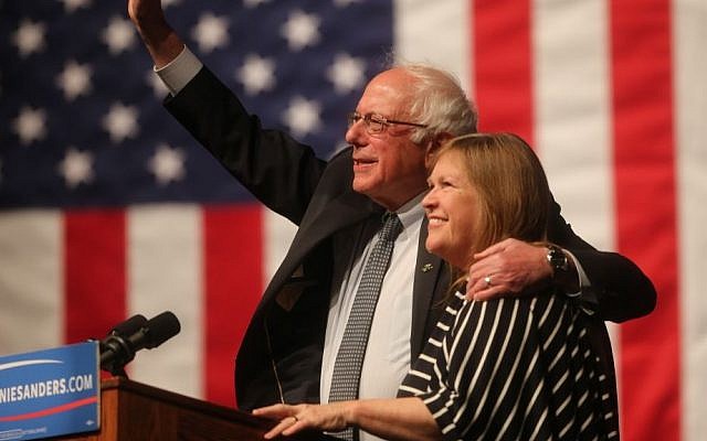Democratic presidential candidate Sen. Bernie Sanders, I-Vermont, waves to the crowd with his wife, Jane Sanders, during a campaign rally at the University of Wyoming in Laramie, Wyoming, on April 5, 2016. (Blaine McCartney/The Wyoming Tribune Eagle via AP)