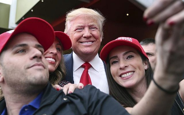 Supporter Pat Montelli, left, and friend Catherine Freeman, right, take a photograph with Republican presidential candidate Donald Trump at a campaign rally Sunday, April 17, 2016, in the Staten Island borough of New York. (AP/Mel Evans) Supporter Pat Montelli, left, and friend Catherine Freeman, right, take a photograph with Republican presidential candidate Donald Trump at a campaign rally Sunday, April 17, 2016, in the Staten Island borough of New York. (AP/Mel Evans)