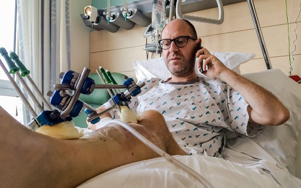 Brussels bombing survivor Walter Benjamin makes a phone call as he rests in his bed in Jette University Hospital in the city on Sunday, April 3, 2016 (AP Photo/Helene Franchineau) Brussels bombing survivor Walter Benjamin makes a phone call as he rests in his bed in Jette University Hospital in the city on Sunday, April 3, 2016 (AP Photo/Helene Franchineau)