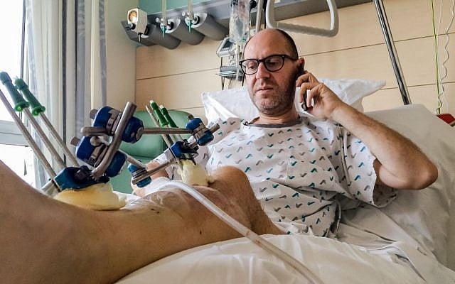 Brussels bombing survivor Walter Benjamin makes a phone call as he rests in his bed in Jette University Hospital in the city on Sunday, April 3, 2016 (AP Photo/Helene Franchineau) Brussels bombing survivor Walter Benjamin makes a phone call as he rests in his bed in Jette University Hospital in the city on Sunday, April 3, 2016 (AP Photo/Helene Franchineau)