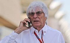 Bernie Ecclestone, chief executive of the Formula One Group talks on his mobile phone ahead of the Bahrain Formula One Grand Prix at the Formula One Bahrain International Circuit, in Sakhir, Bahrain, Sunday, April 3, 2016. (AP Photo/Kamran Jebreili)