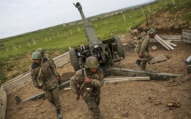 Nagorno-Karabakh army artillerymen prepare to open fire from a howitzer on positions in Nagorno-Karabakh, Azerbaijan, April 5, 2016. (Vahan Stepanyan/PAN via AP)
