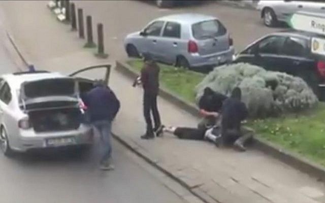 In this video image, Belgian police arrest Brussels terror attack suspect Mohamed Abrini in the Anderlecht area of Brussels, Friday, April 8, 2016. (AP/Sebastian Kamran)
