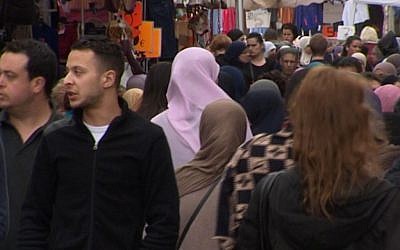 This is an image taken from video on Wednesday April 13, 2016 of of Salah Abdeslam, left, the fugitive from the Nov. 13 Paris attacks whose capture appears to have precipitated the March 22 bombing in Brussels. (TVbrussels via AP)