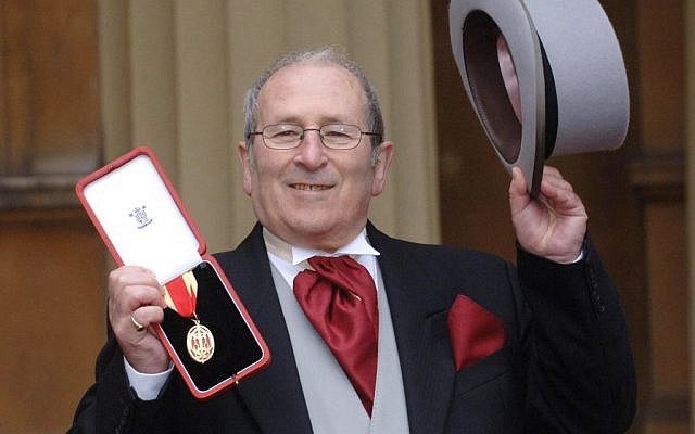 British playwright Arnold Wesker poses at Buckingham Palace, London, after being knighted, February 22, 2006. (Stefan Rousseau/PA via AP)