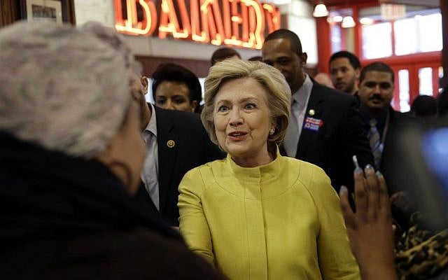 Democratic presidential candidate Hillary Clinton talks to customers at Junior's restaurant in the Brooklyn borough of New York, Saturday, April 9, 2016. (AP Photo/Seth Wenig)