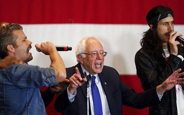 Democratic presidential candidate Sen. Bernie Sanders, I-Vt., sings during a campaign event, Monday, April 4, 2016, in Milwaukee. (AP Photo/Paul Sancya)