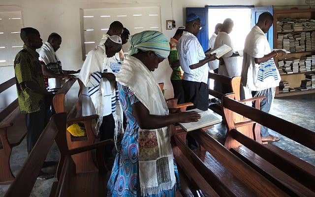 Men and women sit separately in the Sefwi Wiaso synagogue, but both wear tallit, the traditional prayer shawls. (Melanie Lidman/Times of Israel)