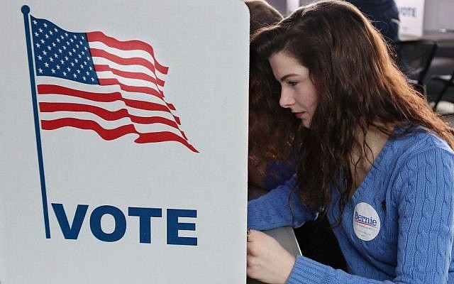 Abi Nesbitt, a UW-Eau Claire freshman from Mosinee, Wis., votes in her first primary election at UW-Eau Claire's Davies Center on Tuesday morning, April 5, 2016. (Dan Reiland/The Eau Claire Leader-Telegram via AP)